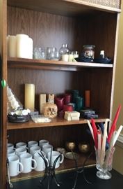 assorted collection of candles and Secretary bookshelf
