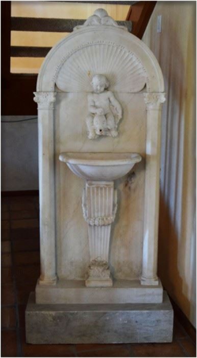 19thc, Italy, Carved marble wall fountain with putti  riding  a  dolphin, 75”h  x  33”w  x  10”d  
