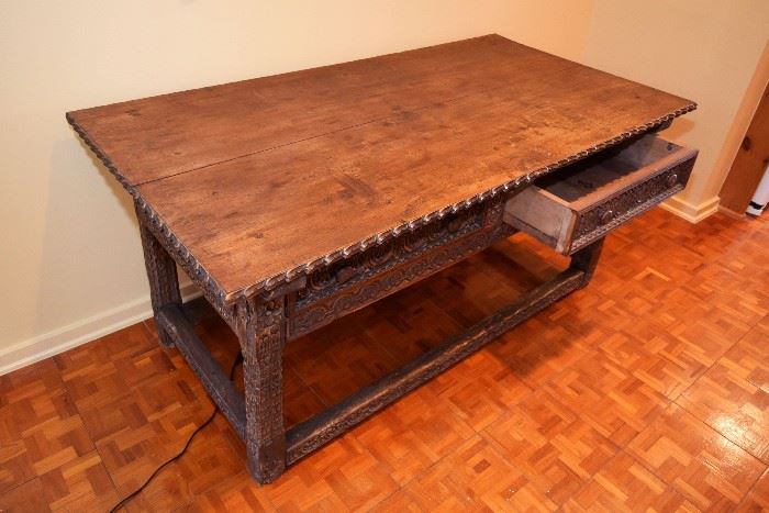 Four  carved  legs  connected  with  mortise  and  tenon  joins  to  the  rectangular  
Stretchers  supporting  a  frieze  with  two  carved  drawers  on  each  of  the  long  Sides  with  a  two  board  top,  31.5”  h  x  60”l  x  14”d.  