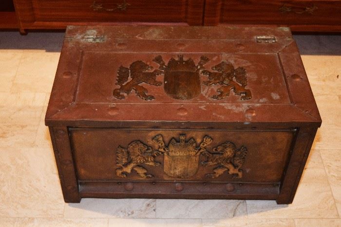 c.  1900,  England.  Copper  coal/kindling  box  with  applied  brass  coat  of arms  decoration,  17”h  x  30”w  x  18”d.  
