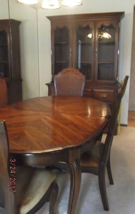 Dining Room Table (61" x 42") w/4 chairs + two 18" leaves + custom made table pad. (Note: Hutch behind table has been sold)