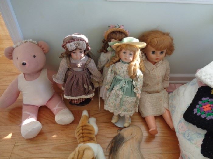 Collection of dolls and plush animals