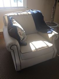 $200 Ivory club chair with nail head and piping