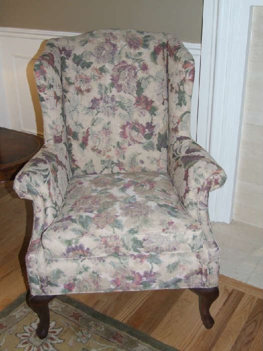 PAIR OF SOFT FLORAL DESIGN WING BACK CHAIRS FROM NORWALK FURNITURE COMPANY.