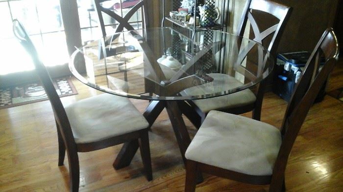 Glass top table with wooden base and 4 suede chairs
