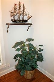 Silk plant and model sailing ship