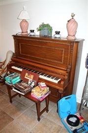 Upright piano with bench