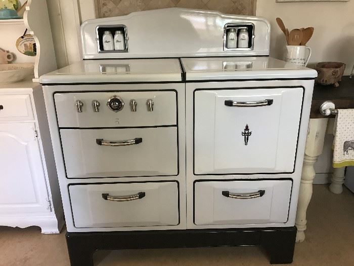 Vintage gas stove/gas oven, 1935 Wedgewood,  4-burners, white enamel. This stove works perfect and cooks beautifully! It also has a light and condiment jars, which are included. Will miss this stove but can't take it with me. It was professionally fully restored in 2013.