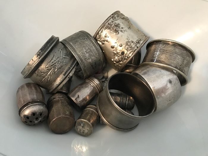 Collection of sterling napkin rings and small salt & peppers