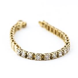 14K Yellow Gold and Diamond Bracelet with Extra Links: A 14k yellow gold and diamond bracelet with extra links. It features a chain of diamonds set in rectangular gold links. Includes two separate links.