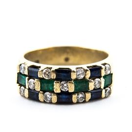 14K Yellow Gold, Diamond, Sapphire, and Emerald Ring: A 14k yellow gold, diamond, sapphire, and emerald ring. It features a checkerboard pattern of diamonds, sapphires, and emeralds set on a golden band.