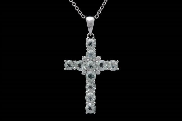 18K White Gold, Green Amethyst and Diamond Cross with Chain: An 18K white gold, green amethyst and diamond cross with chain. The cross features eleven round green amethysts with diamonds accenting the cross bar. Included is an 18" 18K white gold cable chain with a spring ring clasp.