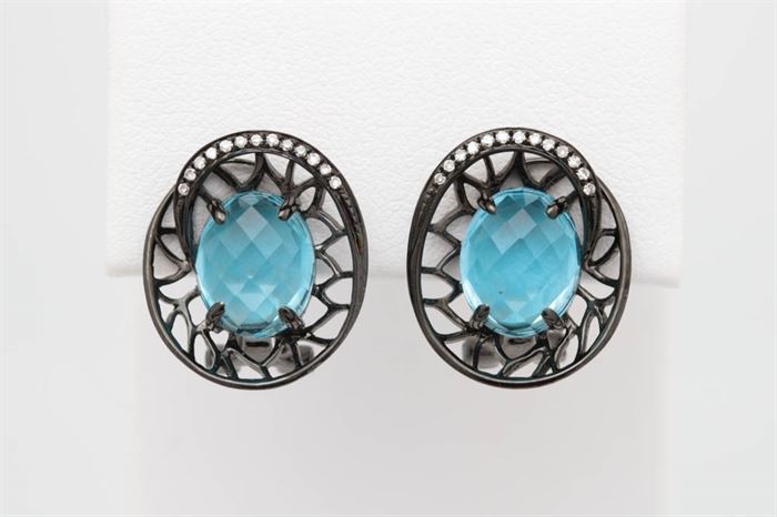 14K Black Gold, Blue Topaz, and Diamond Earrings: A pair of 14K black gold, blue topaz and diamond earrings.