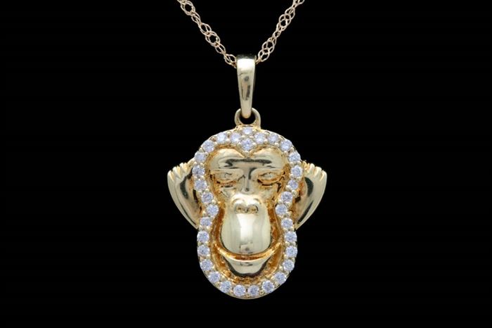 18K Yellow Gold and Diamond "Hear No Evil" Pendant with Chain: An 18K yellow gold and diamond “hear no evil” pendant with chain. The monkey’s face is edged in diamonds and features prominent ears. The pendant measures approximately 0.50″ × 0.70″, inclusive of bail. Included is an 18" 18K yellow gold cable chain with a spring ring clasp.