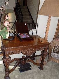 Antique table and hand carved walnut lamp