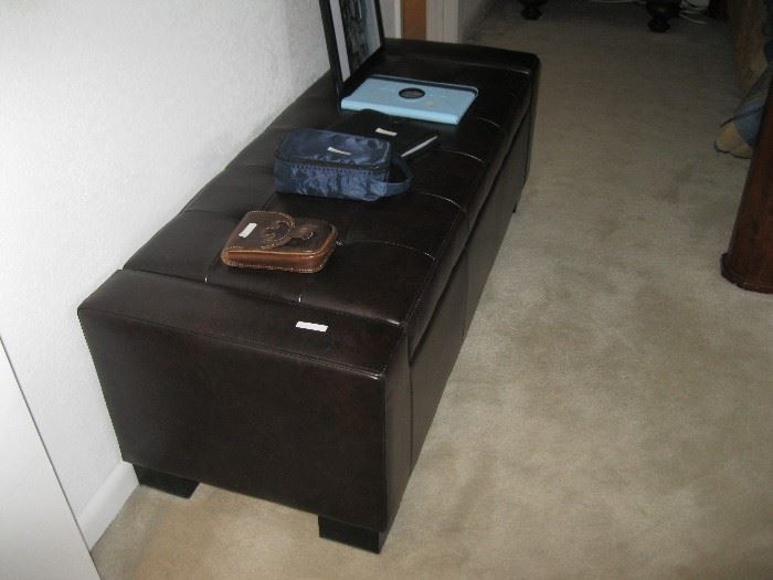 Large ottoman also lifts up for storage. 