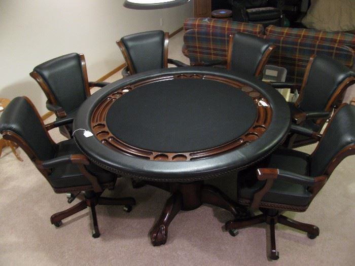 Game table top will flip flop to a smooth surface from poker top with glass holders.