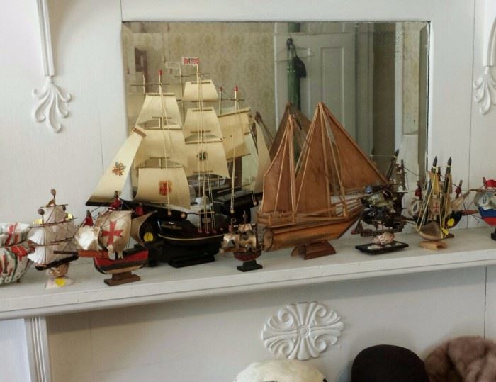 Collection of miniature ships and hats, including mink hats