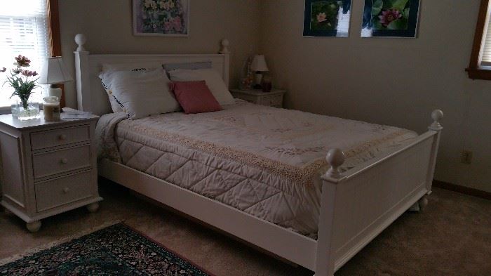 Sorry this is a poor picture - but a beautiful bedroom set.  White hardwood queensize bed with two nightstands.  Mattress is electric adjustable on platform in excellent condition