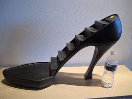 Many uses for this oversized high heel with stair-stepped shelves