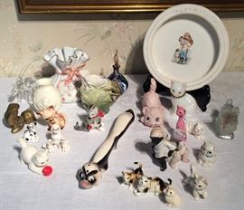 Hand painted porcelain and ceramic figures including: Pepe La Pew, frog handled creamer and a herd of cats