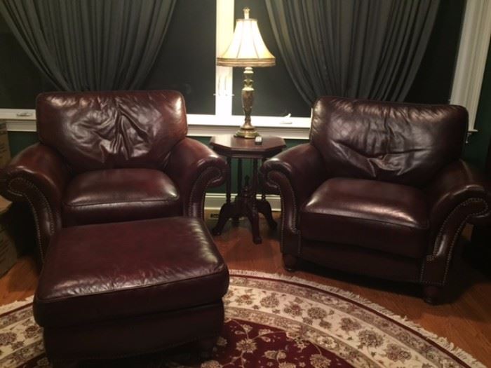 2 plush leather chairs.  Leather in excellent condition.  Includes Ottoman and Leather Conditioning Kit.