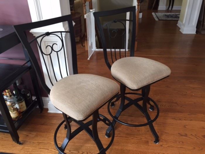 2 Counter-height, swivel chairs that go with kitchen table.