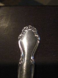 Pattern shot of wedding bells silver flatware