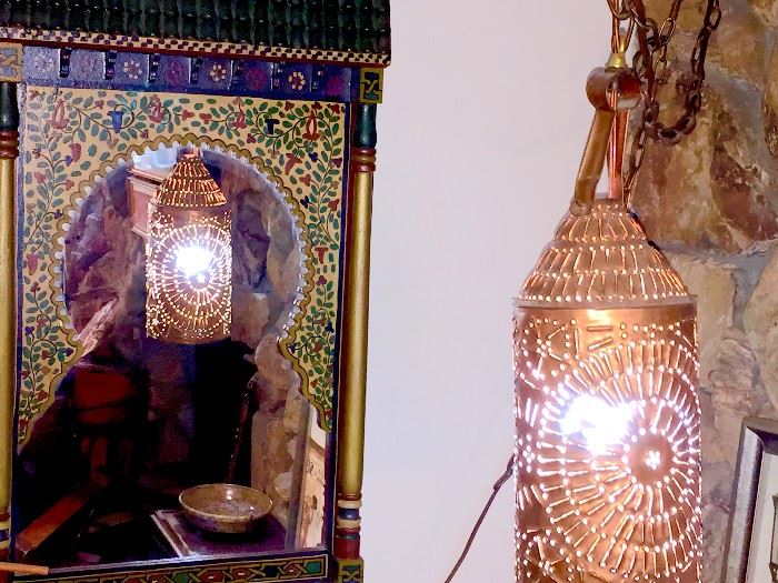 Moroccan style painted mirror and pierced hanging lamp