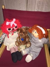 Raggedy Ann and Andy with their Cabbage patch doll on a directors chair