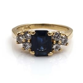 14K Yellow Gold Sapphire and Diamond Ring: A 14K yellow gold sapphire and diamond ring.
