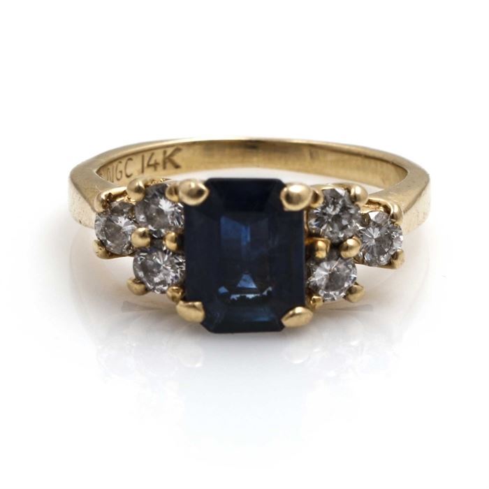 14K Yellow Gold Sapphire and Diamond Ring: A 14K yellow gold sapphire and diamond ring.