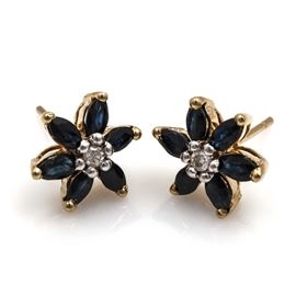 14K Yellow Gold Sapphire and Diamond Floral Studs: A pair of 14K yellow gold sapphire and diamond floral stud earrings.