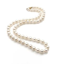 Pearl Necklace with 14K Yellow Gold Filigree Clasp: A cultured pearl necklace with a 14K yellow gold filigree clasp. The pearls on this hand-knotted strand feature creamy white color with very good luster and rosé overtones.
