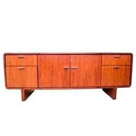 BiltRite Elite Rosewood Credenza: A BiltRite Elite rosewood credenza. This item features two cabinet doors, two drawers, and two filing cabinet drawers. The hardware for the credenza is silver tone. The piece is marked on the inside of the cabinet door with “Elite BiltRite Montreal, Que., Canada.”
