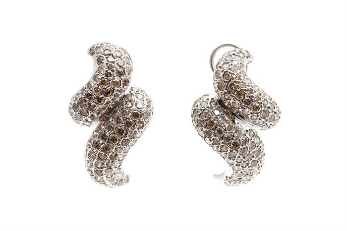 14K White Gold 7.00 CTW Diamond Earrings: A pair of white gold swirl earrings encrusted with pave’ set round cut diamonds.