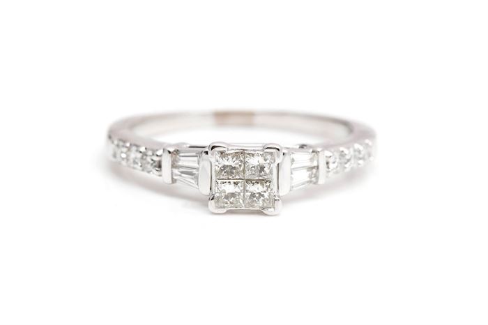 14K White Gold 0.67 CTW Diamond Engagement Ring: A white gold engagement ring with square cut invisible set diamonds to the center and channel set baguette and round cut diamond accents o the top half of the shank.