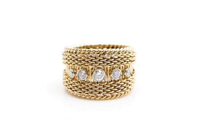 18K Yellow Gold Diamond Twisted Rope Band: A yellow gold twisted rope band with round cut bezel set diamonds in the center that graduate in size.