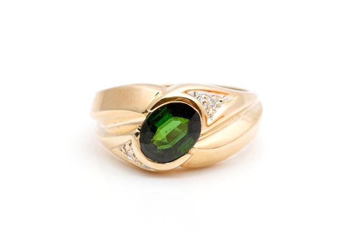 14K Yellow Gold Green Tourmaline and Diamond Ring: A wide tapered yellow gold shank with oval faceted green tourmaline to the center and diamond accents offset to the shoulders.
