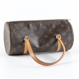 Louis Vuitton Monogram Papillon Bag: A 2003 Louis Vuitton Monogram Papillion bag. This barrel shaped bag features the classic monogrammed canvas with vachetta leather shoulder straps and trim. The piece is finished with interior lining and pocketing. The date code is SD0063. Made in the United States.