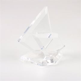 Eric Bauer Geometric Lucite Sculpture: A sculpture in lucite by listed American artist Eric Bauer (20th century). The untitled abstract work depicts two clear faceted geometric shapes set to the top of a matching faceted base. The piece has an etched signature by the artist to the underside, but otherwise unmarked.
