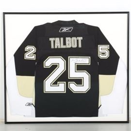 Autographed Maxime Talbot Jersey: An autographed Maxime Talbot jersey. This Pittsburgh Penguins jersey from the 2009 Stanley Cup season is signed by center Maxime Talbot. Talbot spent six of his thirteen seasons in the NHL with Pittsburgh. The jersey is presented behind glass in a metal frame.