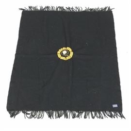 Vintage Pendleton Pittsburgh Steelers Wool Throw: A vintage Pittsburgh Steelers wool throw blanket. This blanket is black wool and features a vintage Pittsburgh Steelers helmet logo in the center and black tassels on each end. It is marked “Pendleton – 100% virgin wool” on the tag on the lower right.