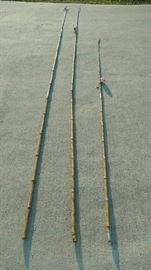 11 ft antique cane fishing poles...wooden bobbers