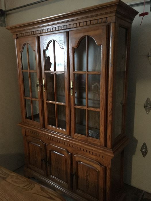 This is a beautiful oak china cabinet with matching table and chairs.