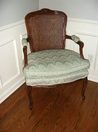 Vintage cane back Queen Style arm chair.