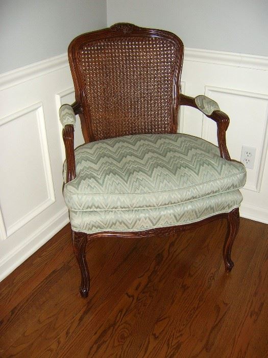 Vintage cane back Queen Style arm chair.