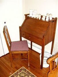 Antique oak drop front desk and chair.