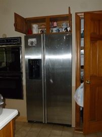 That's little pieces of tape on the fridge..and it's been removed since the photo was taken. There's nothing wrong with it..it's in great shape!