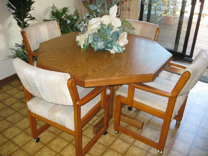 wood dining set with 4 chairs on casters
